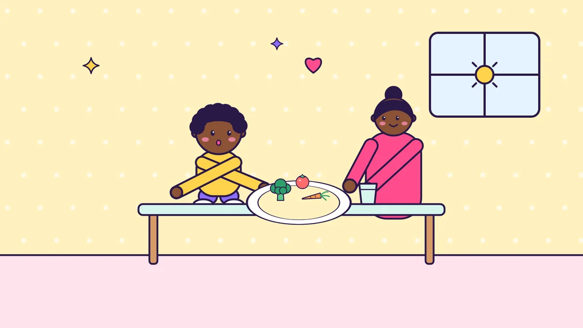 Cartoon illustration of a toddler with crossed arms sitting at a table beside a smiling parent, with a plate of broccoli, carrot and tomato and a cup